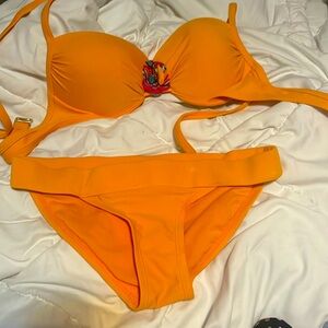 Orange bikini with flower in the middle of the top very good condition